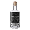 En gennemsigtig flaske Volsted Starling Gin fra Volsted Distillery, der præsenteres som en gin i begrænset oplag, destilleret i Danmark, med et minimalistisk sort-hvidt motiv af bjerge og en fugl.
